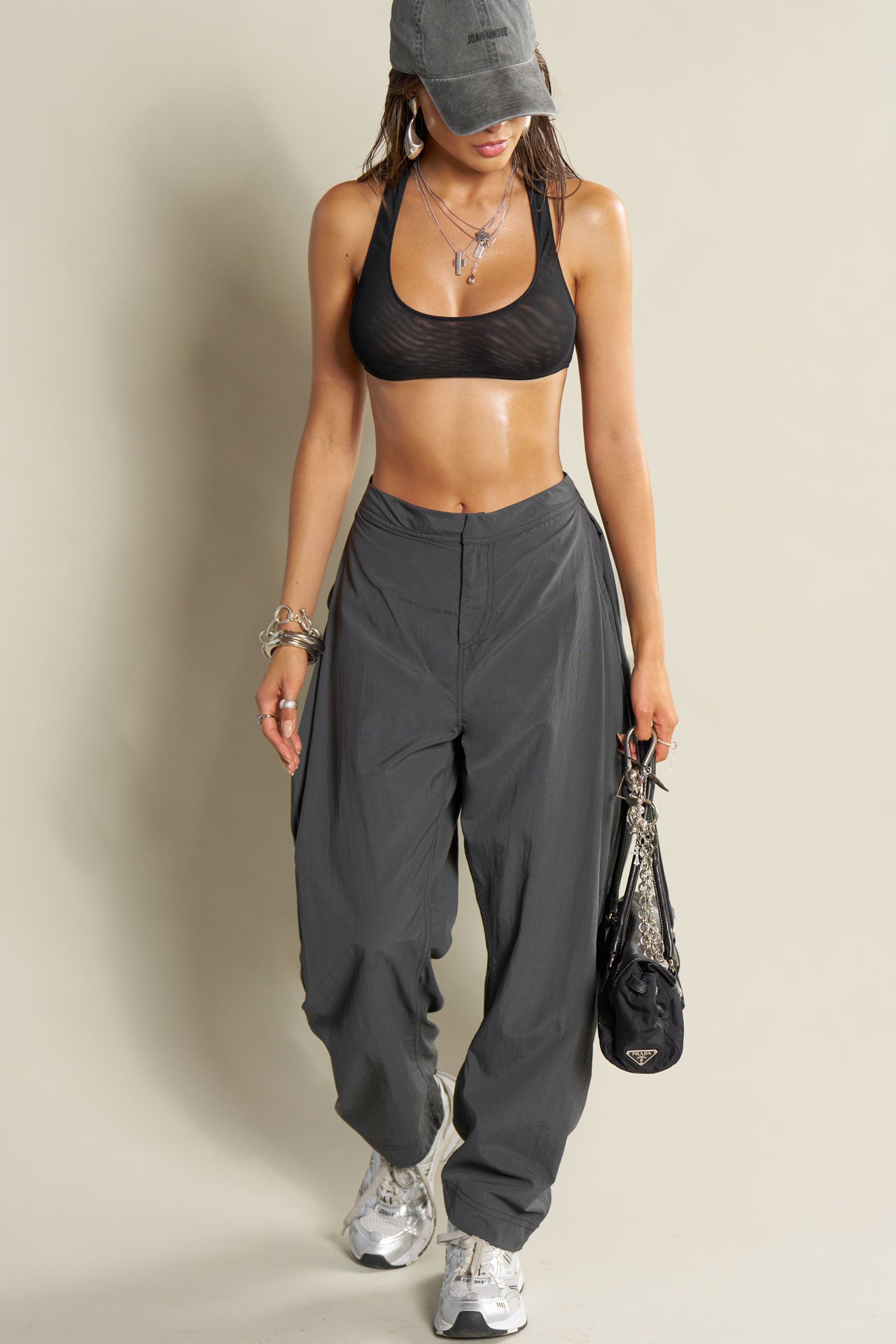 Full body front view of model posing in the sheer black mesh Scoop Neck Racerback Bra with a scoop neckline