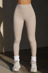Front view of model from the waist down posing in the full length and high-waisted sueded yuma Second Skin Legging with a wide, v-shaped waistband