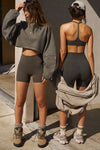 Two models posing in Joah Brown top and bottoms sets