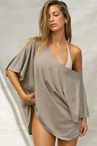 Front view of model posing in the oversized sage grey classic cotton Slouchy Tunic Tee with a wide scoop neckline that can be worn off the shoulder