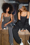 2 models posing in sueded Smoothing Camis and Oversized Straight Leg Jogger sets
