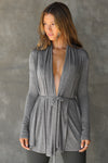 Front view of model posing in the light weight long sleeve ash grey modal Tie Cardigan with adjustable ties at the waist