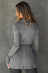 Back view of model posing in the light weight long sleeve ash grey modal Tie Cardigan with adjustable ties at the waist