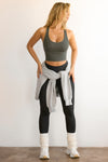 Full body front view of model posing in the fitted stretchy cropped mineral flexrib Varsity Tank Bra with a scoop neckline