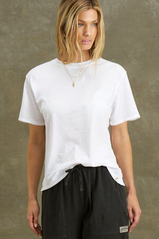 Front view of model posing in the optic white classic cotton Vintage Tee with a crew neckline and relaxed silhouette