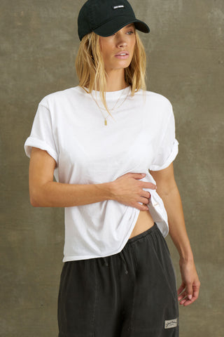 Front view of model posing in the optic white classic cotton Vintage Tee with a crew neckline and relaxed silhouette