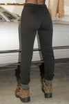 Back view of model from the waist down posing in the tapered black french terry Empire Jogger with side pockets and an elastic waistband and ankle cuffs