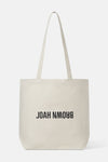 Flat lay front view of the cotton canvas natural Tote Bag with shoulder straps and a black Joah Brown logo on the front