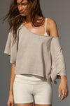 Front view of model posing in the relaxed fit and boxy sandstone cotton Off Shoulder Tee with a wide scoop neckline that can be worn off the shoulders.