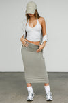 Full body front view of model posing in the fitted sage model Foldover Maxi Skirt with an adjustable fold over waistband
