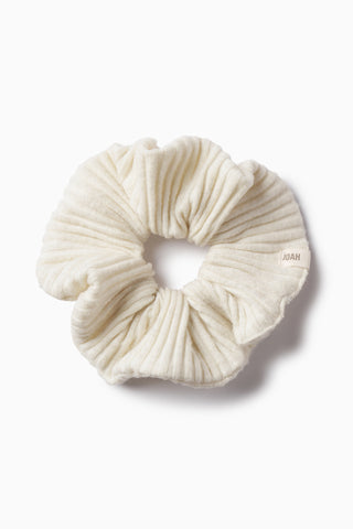 Flay lay view of soft and stretchy natural luxe knit Knit Scrunchie 