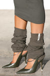 Close up side view of the slouchy, pull on army luxe knit Leg Warmers that can be worn pulled up on scrunched down