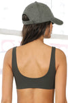 Back view of model wearing the six-panel washed green Official Cap with a curved brim and adjustable strap