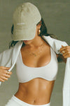 Front view of model wearing the six-panel desert Official Cap with a curved brim and an embroidered upside down Joah Brown logo on the front