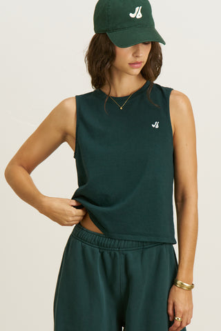Front view model posing in the relaxed fit alpine cotton Muscle Tank with a crew neckline