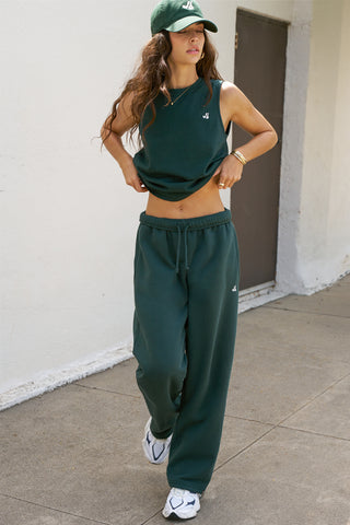 Full body front view model posing in the relaxed fit alpine cotton Muscle Tank with a crew neckline