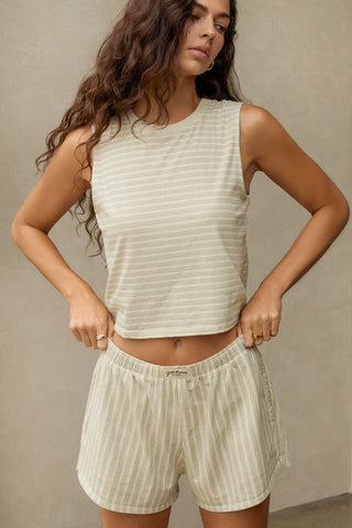 Front view model posing in the relaxed fit sage stripe classic cotton Muscle Tank with a crew neckline