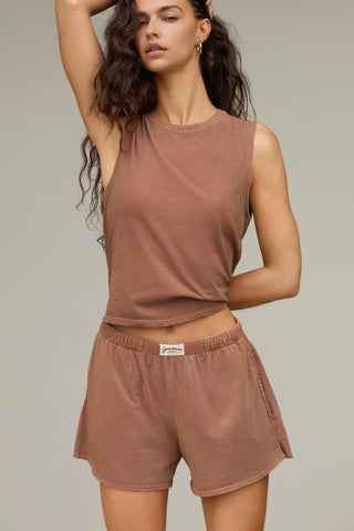 Front view model posing in the relaxed fit tobacco classic cotton Muscle Tank with a crew neckline