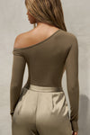 Back view of model posing in the fitted woodland rib Off Shoulder Twist Long Sleeve top asymmetrical neckline with a twist detail and off-shoulder design