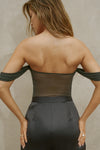 Back view of model posing in the sheer and fitted graphite mesh Off The Shoulder Bandeau Tank with thin straps and draped sleeves and can be worn off the shoulder or with the sleeves up