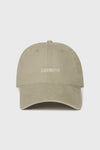 Flat lay front view of the six-panel desert Official Cap with a curved brim and an embroidered upside down Joah Brown logo on the front