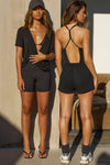 Two models posing in black model Joah Brown outfits