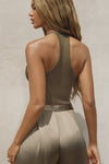 Back view of model posing in the fitted woodland flexrib Plunge Racerback Tank top with a racerback silhouette.