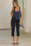 Full body front view of model posing in the lightweight relaxed fit navy modal Plunge Tank with a plunging u-neckline