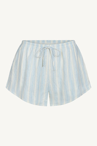Flat lay front view of the relaxed fit lightweight natural white and blue stripe gauze Relaxed Everyday Short with an elastic waistband and adjustable front tie