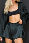 Front view of model posing in the comfortable, boxer-style midnight Relaxed Silk Short with an elastic waistband
