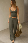 Full body front view of model posing in the fitted spruce modal Scoop Neck Cami with thin adjustable straps, scoop neckline and scoop back