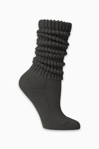Flat lay side view of the slouchy coal Scrunch Sock with extra long ribbed cuffs