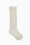 Flat lay side view of the slouchy off white Scrunch Sock with extra long ribbed cuffs
