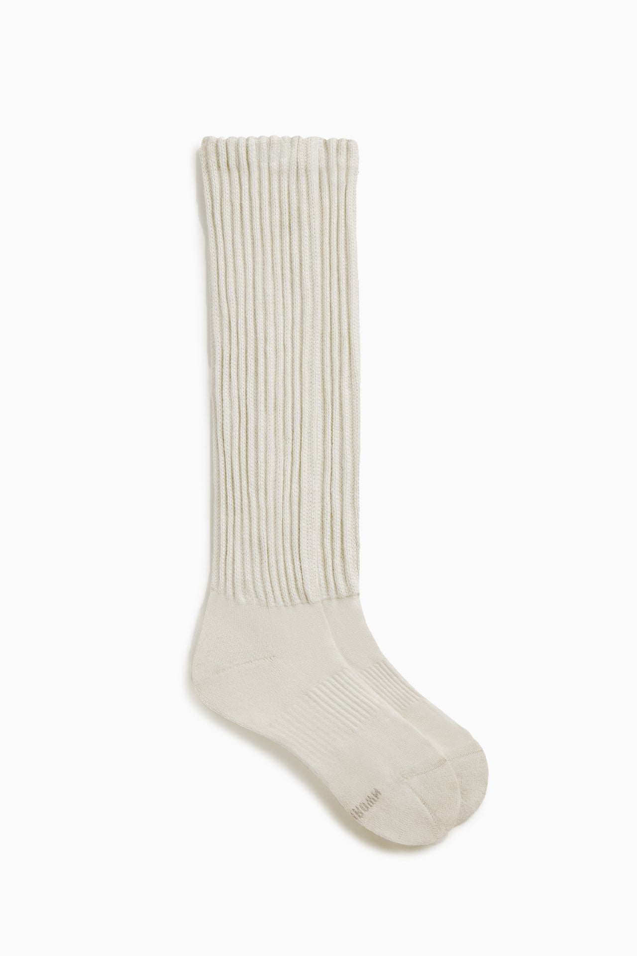 Flat lay side view of the slouchy off white Scrunch Sock with extra long ribbed cuffs