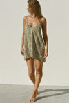 Full body front view of model posing in the lightweight orchard gauze Shift Mini Dress with a scoop neckline, front keyhole detail and open back with adjustable straps and a tie closure