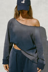 Front view of model posing in the oversized heritage washed navy french terry Slouchy Pullover Sweatshirt with a wide, off-the-shoulder neckline and a JOAH BROWN logo patch on the right sleeve