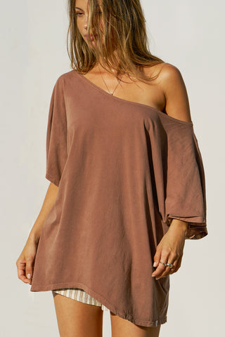 Front view of model posing in the oversized tobacco classic cotton Slouchy Tunic Tee with a wide scoop neckline that can be worn off the shoulder
