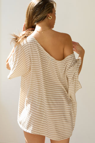 Back view of model posing in the oversized tobacco stripe classic cotton Slouchy Tunic Tee with a wide scoop neckline that can be worn off the shoulder