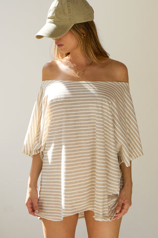 Front view of model posing in the oversized tobacco stripe classic cotton Slouchy Tunic Tee with a wide scoop neckline that can be worn off the shoulder