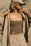 Front view of model posing in the semi-fitted sepia washed rib Square Neck Cami with thin, wide-set straps and a clean, straight neckline.