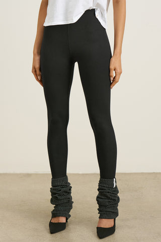 Front view of model from the waist down posing in the sleek and stretchy full length sueded onyx The Body Legging with a mid-rise elastic waistband