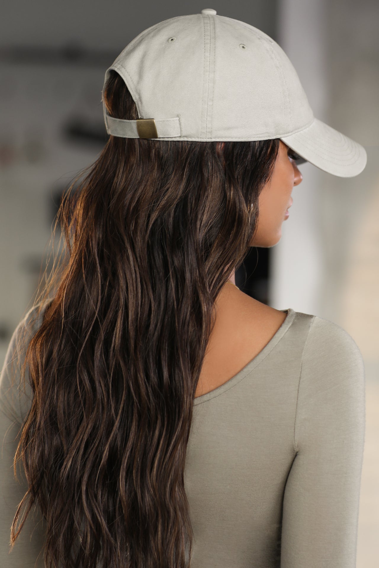 Back view of model wearing the six-panel sahara Official Cap with a curved brim and adjustable strap