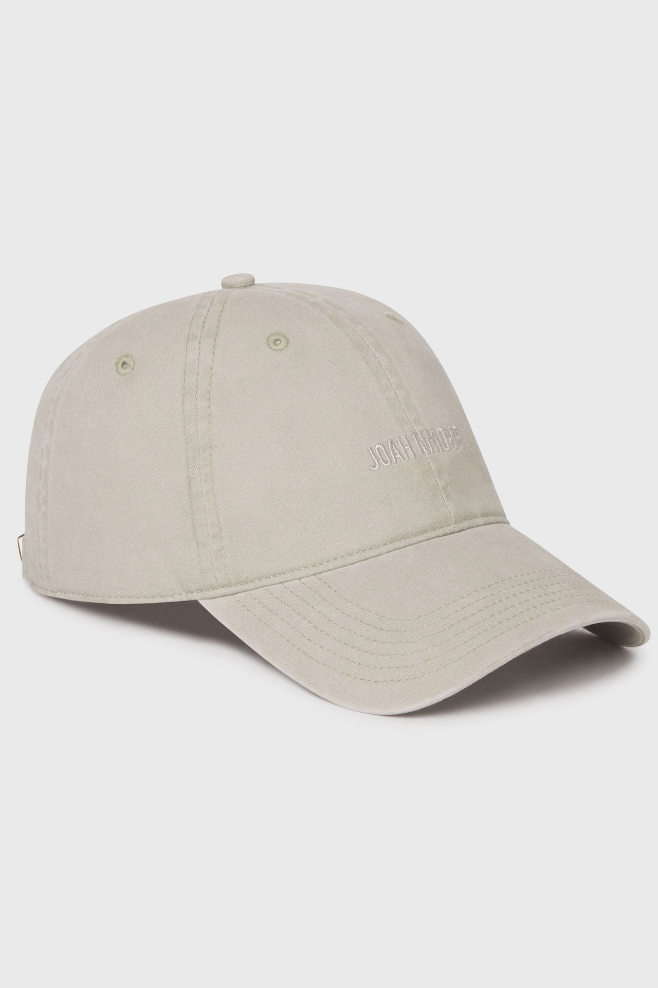 Flat lay side view of the six-panel sahara Official Cap with a curved brim and an embroidered upside down Joah Brown logo on the front