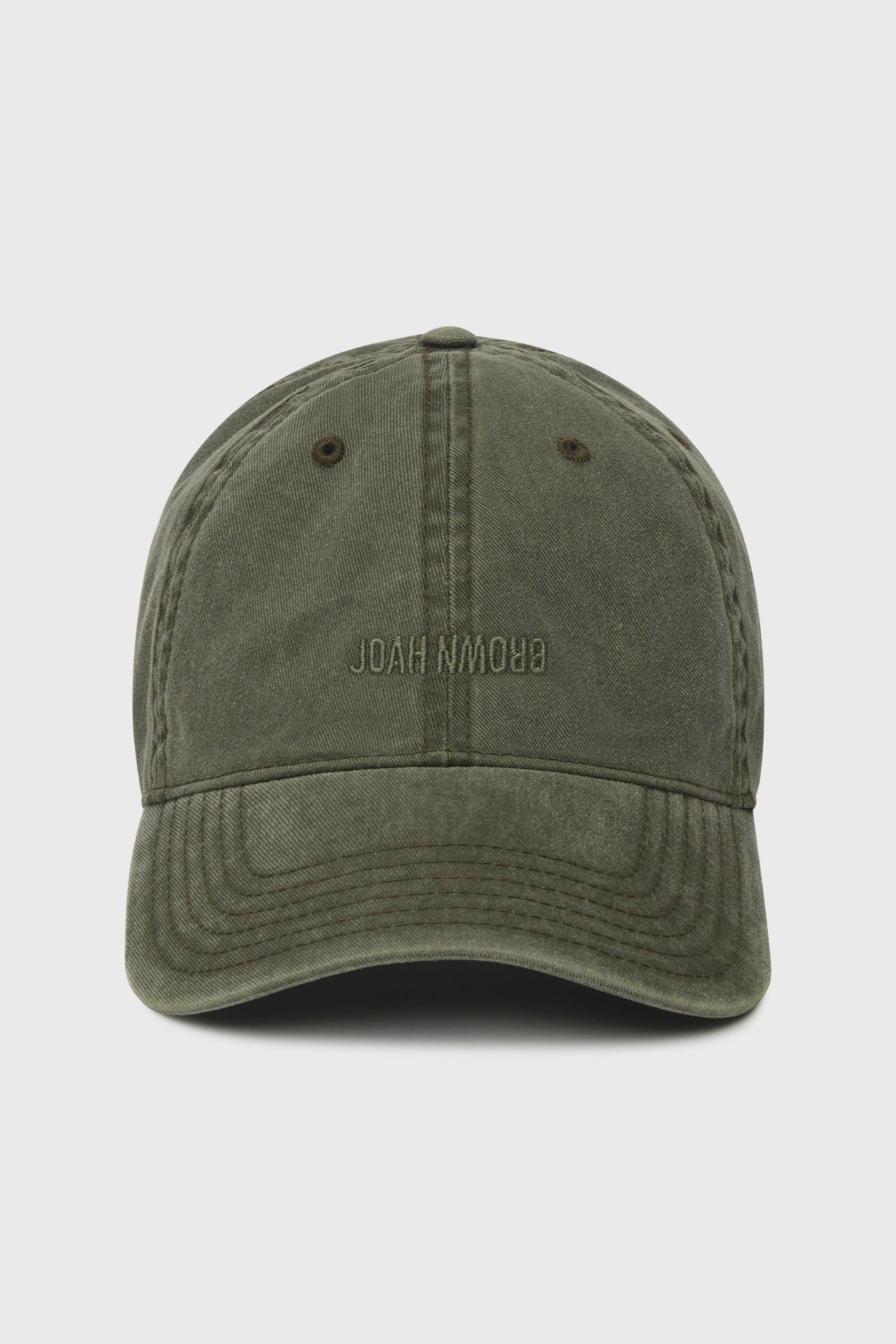 Flat lay front view of the six-panel washed green Official Cap with a curved brim and an embroidered upside down Joah Brown logo on the front