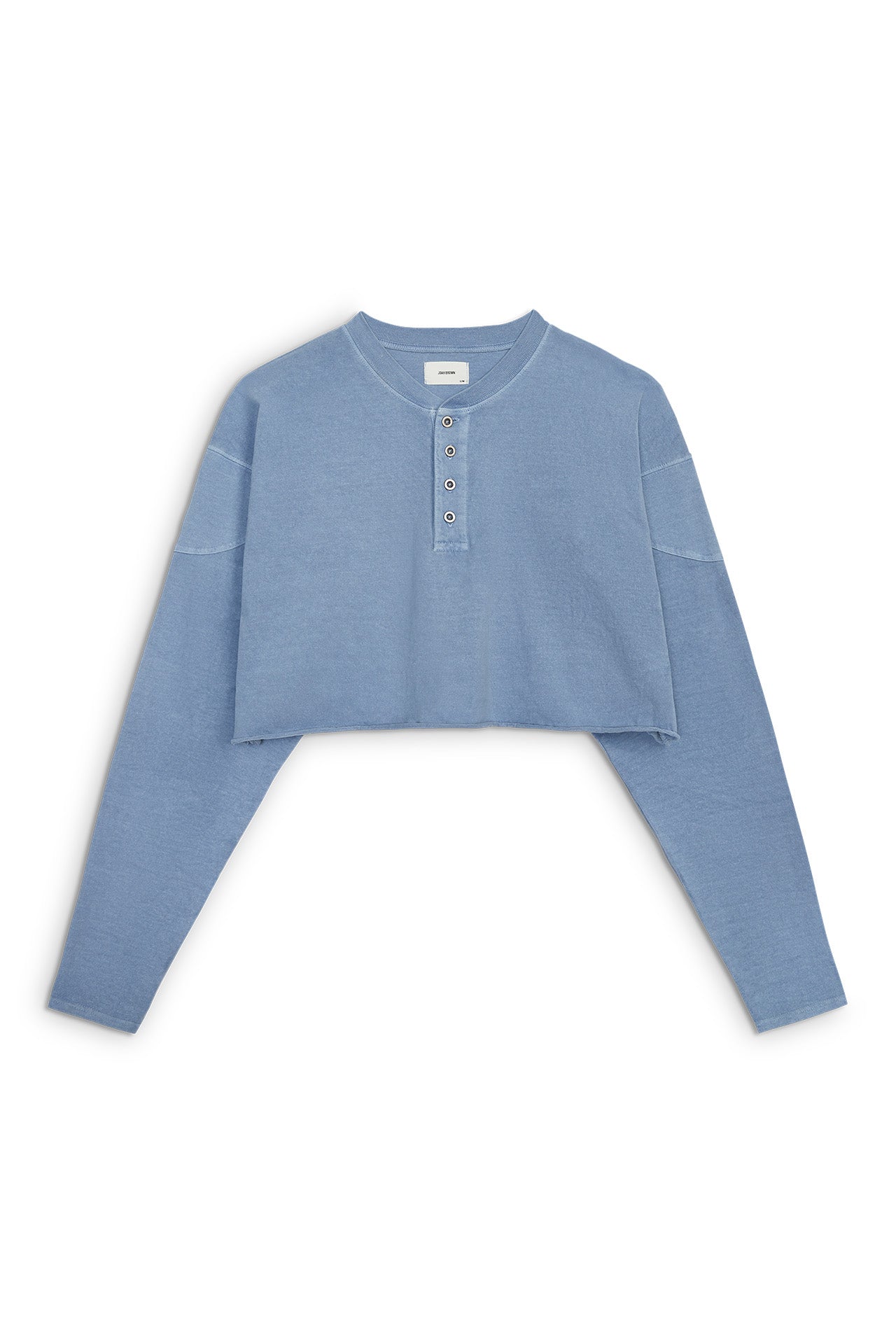 Front flat lay view of the cropped, loose-fitting denim cotton Vintage Henley Long Sleeve top with dropped shoulders and custom JOAH BROWN buttons
