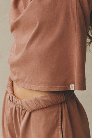 Close up detail side view of model posing in the tobacco stripe classic cotton Vintage Tee with a crew neckline and relaxed silhouette
