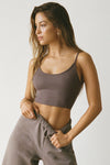 Front view of model posing in the fitted stretchy mauve flexrib Low Back Crop Cami with a scoop neckline and skinny straps