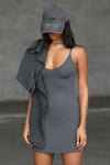Front view of model posing in the form fitting stretchy smoke rib mini Slip Dress with thin straps, a u neckline and a tiny side slit at the hem