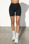 Front view of model from the waist down wearing the soft stretchy high-waisted sueded onyx Biker Short with a wide waistband